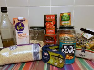 a range of food in cans, jars and packets